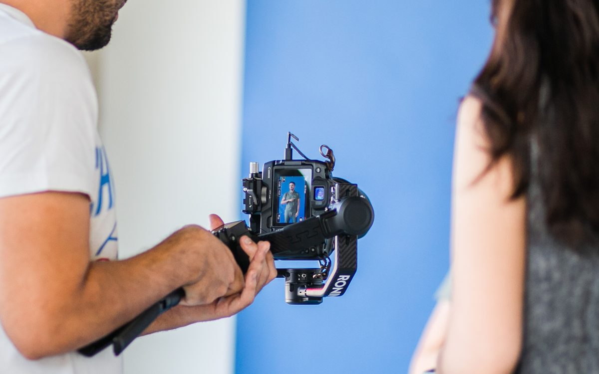 Videographer filming a brand shoot on a gimbal
